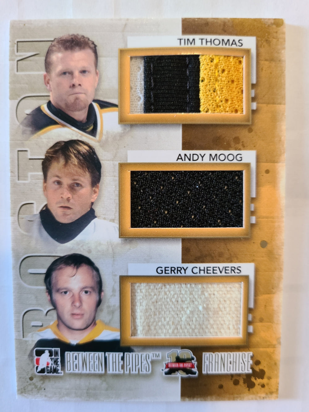 2011-12 ITG Between the Pipes Franchise Jersey GOLD F-02 Tim Thomas/Andy Moog/Gerry Cheevers /10 Boston Bruins